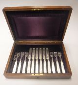 A mahogany cased set of late Victorian silver mounted mother of pearl handled fruit knives and