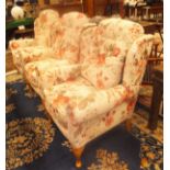 A set of three HSL Hampton Legged Wolsey red floral on a cream ground upholstered wing back scroll