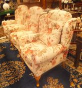 A set of three HSL Hampton Legged Wolsey red floral on a cream ground upholstered wing back scroll