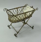 A Victorian laquered brass dolls folding crib on an X-framed base CONDITION REPORTS