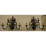 A pair of 20th Century brass five branch wall sconces in the 17th Century Dutch manner