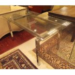 A chrome framed glass top dining table, 150cm x 80cm, together with a single piece glass table,