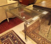 A chrome framed glass top dining table, 150cm x 80cm, together with a single piece glass table,