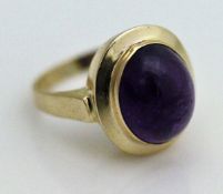 A 14 carat gold dress ring set with oval cabochon cut amethyst CONDITION REPORTS The