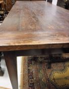 WITHDARWN A modern teak farmhouse style kitchen table in the 19th Century French manner,