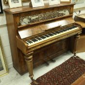 A late Victorian walnut cased upright piano,