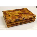 A Baltic amber mounted cigarette box of tiled form,