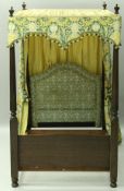 A mahogany framed four poster bed,