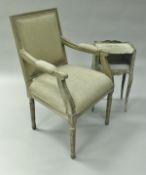 A pair of modern limed beech framed elbow chairs in the Louis XVI taste together with a similar