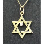 A 14ct gold necklace with Star of David pendant set with a solitaire diamond