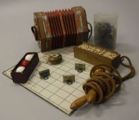 A vintage Viceroy concertina, skipping rope, battleships game,