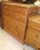 A modern pine chest of two short over three long drawers to bracket feet,