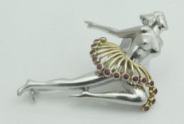 A 1950's 9ct white and yellow gold "Ballerina" brooch, set with fifteen small rubies,
