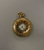 A late 19th Century 18 carat gold cased ladies half hunter fob watch, Swiss movement,