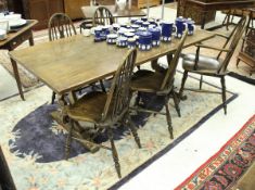 A modern refectory style oak dining table on lyre end supports, 182cm x 89cm,