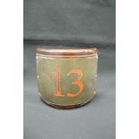 A painted brass mahogany mounted number "13" of curved form,