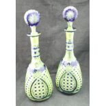 A pair of Bohemian blue overlaid glass decanters with hobnail and pineapple cut decoration,