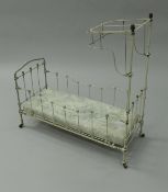 A Victorian painted iron doll's half tester bedstead