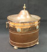 A 19th Century copper and brass mounted lidded coal box of oval form with ring handles,