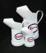 A graduated set of five modern Esso oil cans