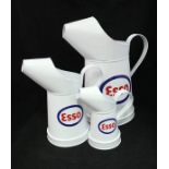 A graduated set of five modern Esso oil cans