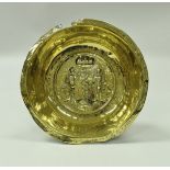 A 17th Century Nuremberg brass bowl the centrefield decorated with Adam and Eve with the serpent