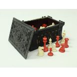 A Jaques of London ivory and red stained chess set in Carton Pierre case,
