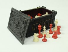 A Jaques of London ivory and red stained chess set in Carton Pierre case,