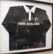 A framed and glazed New Zealand All Blacks rugby shirt,