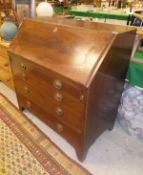 A late George III mahogany bureau,