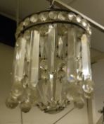 A circa 1900 facet cut glass bag ceiling light with heavy cut glass drops