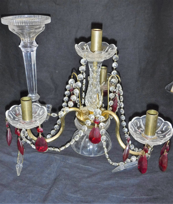 A cut glass and ruby glass four branch épergne and further cut glass candlestick