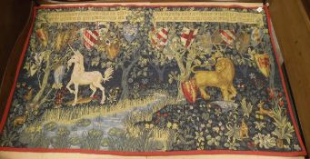 A large wall-hung tapestry depicting the arms of certain Knights of the Round Table with unicorn