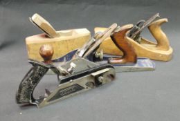 A collection of seven various planes to include a Record Improved Combination plane and accessories