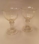 A pair of 18th Century sweetmeat glasses with wrythen bowl on a Silesian stem to domed foot