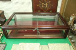 A mahogany and glazed table top display cabinet,