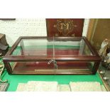 A mahogany and glazed table top display cabinet,