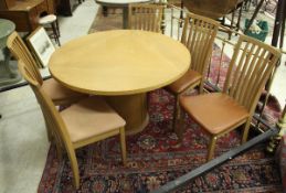 A Skovby oak circular dining table,