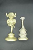 A Victorian brass pineapple doorstop and another as an imp or mythical horned beast