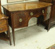 A George III mahogany bow front sideboard, the plain top above one narrow and two deep drawers,