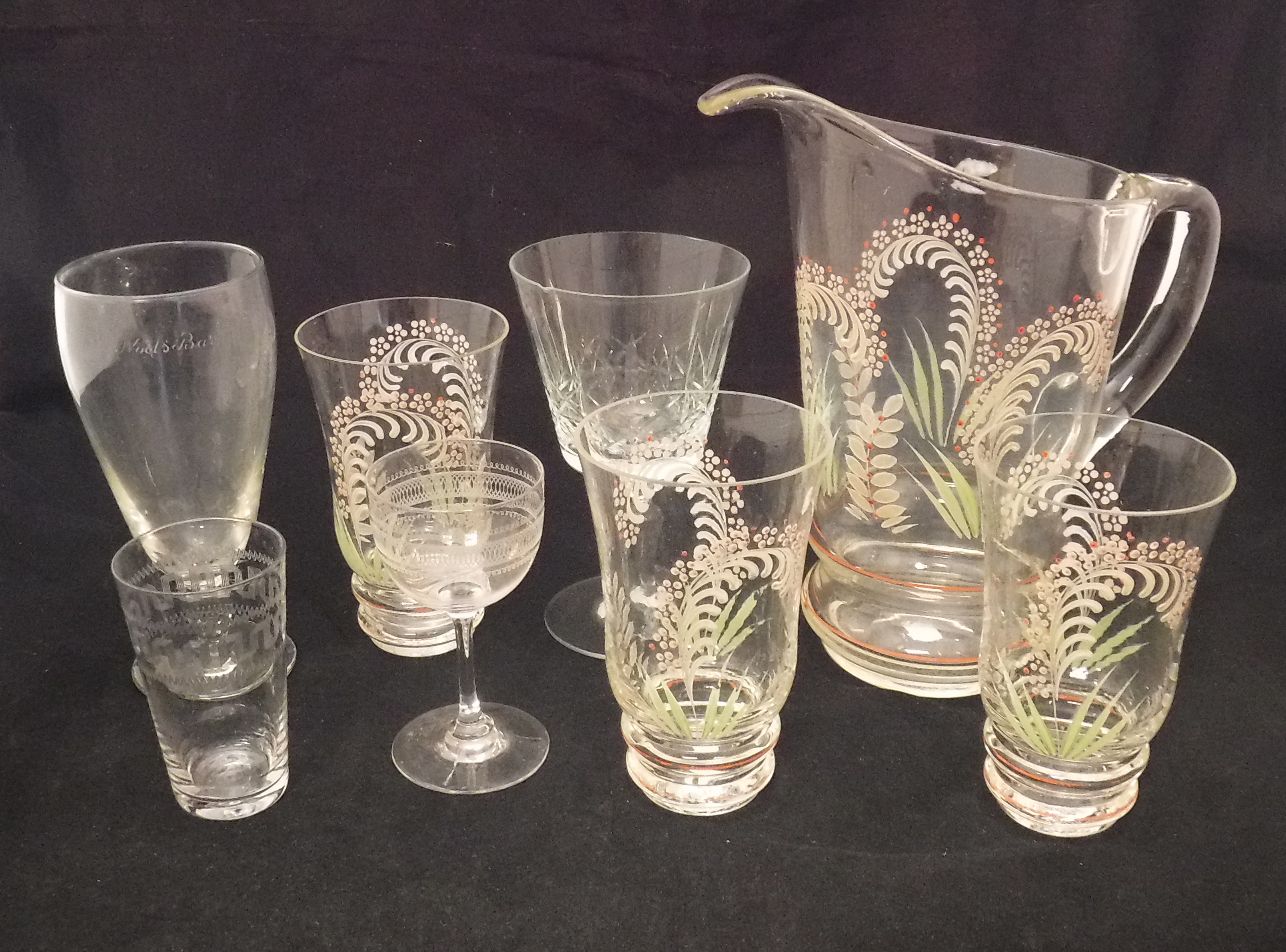 An early 20th Century glass lemonade set with enamelled floral decoration (poss Lily of the Valley),