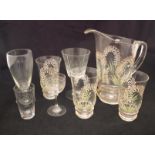 An early 20th Century glass lemonade set with enamelled floral decoration (poss Lily of the Valley),