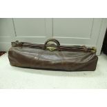 A vintage leather and brass embellished cricket bag of Gladstone style