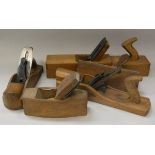 A collection of five various wooden planes including a 1/6 inch jack plane,