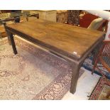 An Indian teak dining table, 178cm x 101cm, with plank top on square chamfered supports,