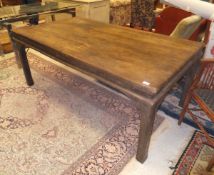 An Indian teak dining table, 178cm x 101cm, with plank top on square chamfered supports,