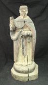 A 17th Century carved wooden figure of St Vincent with painted decoration,