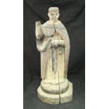 A 17th Century carved wooden figure of St Vincent with painted decoration,