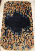 An Art Deco Chinese carpet, the dark blue ground with blue,