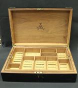 A Monte Christo habana ebonised and brass bound humidor with lift out tray